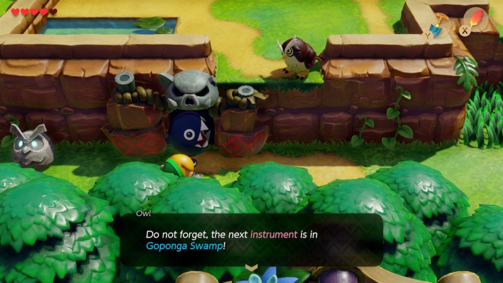 The wise Owl giving a player a hint about how to get into level 2 - Bottle Grotto.