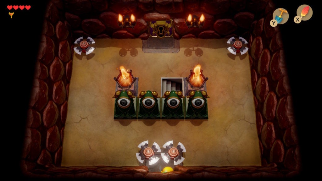 A room with 4 blade trap enemies around the edges, a staircase, and a special locked door.
