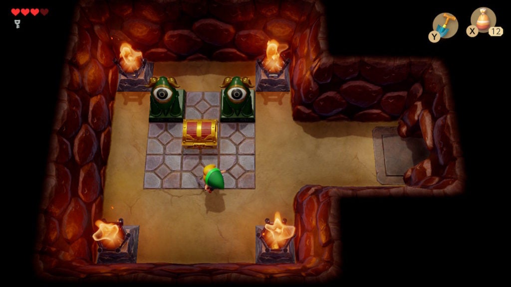 A room with 2 eye statues and 1 chest, the latter of which contains the compass for this dungeon.