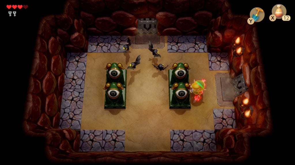 A room with 4 statues, 4 keese, and cracked floor tiles around the edges.
