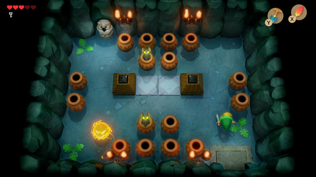 A room with many pots, 2 keese, 1 spark, an owl statue, and 2 moveable blocks in the center.