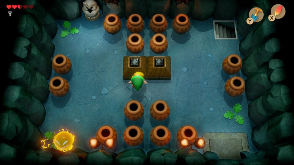 A room with many pots, an owl statue, 1 spark, 2 blocks in the center, and a staircase in the northeast corner.