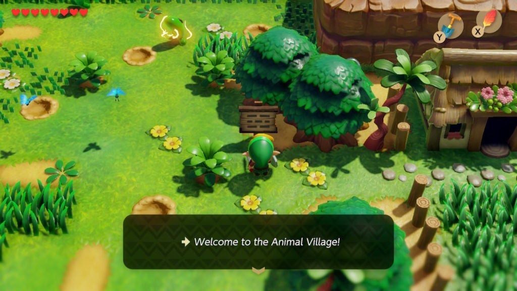 Link reading a sign with an arrow that points east and says "welcome to the animal village!"