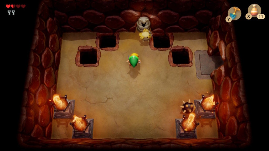 A room with 2 spiked beetles, 4 holes in the floor, and 1 owl statue.