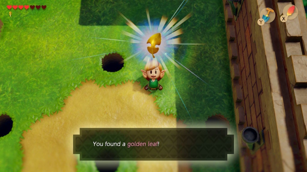 Link holding up the golden leaf they just got from defeating Mad Bomber.