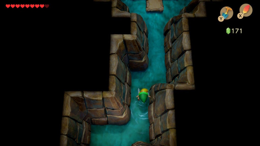 Link walking north in a thing cavern full of shallow water.