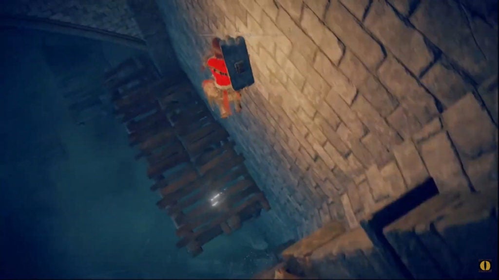 Player jumping down wooden platforms in a dark underground area.