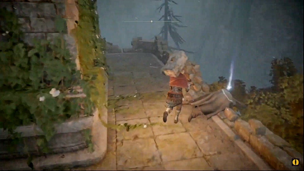 Player looting a corpse for a rune arc in Caria Manor.