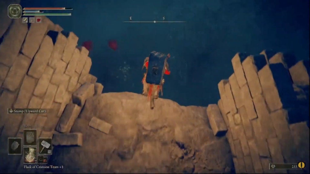 Player stepping off a ledge into a dark pit.