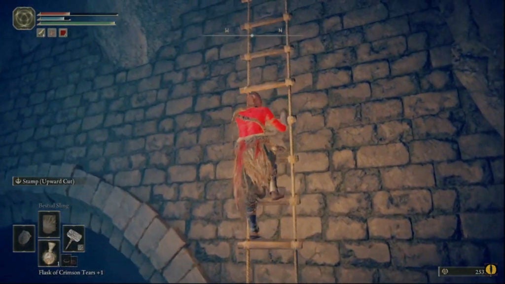 The player climbing a ladder out of the dark pit.
