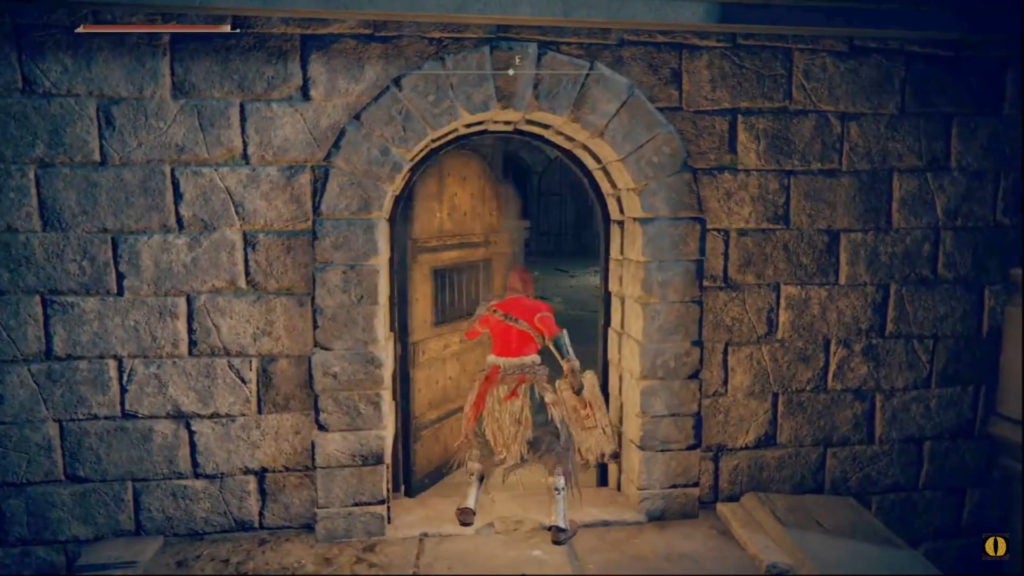 The player opening a wooden door.