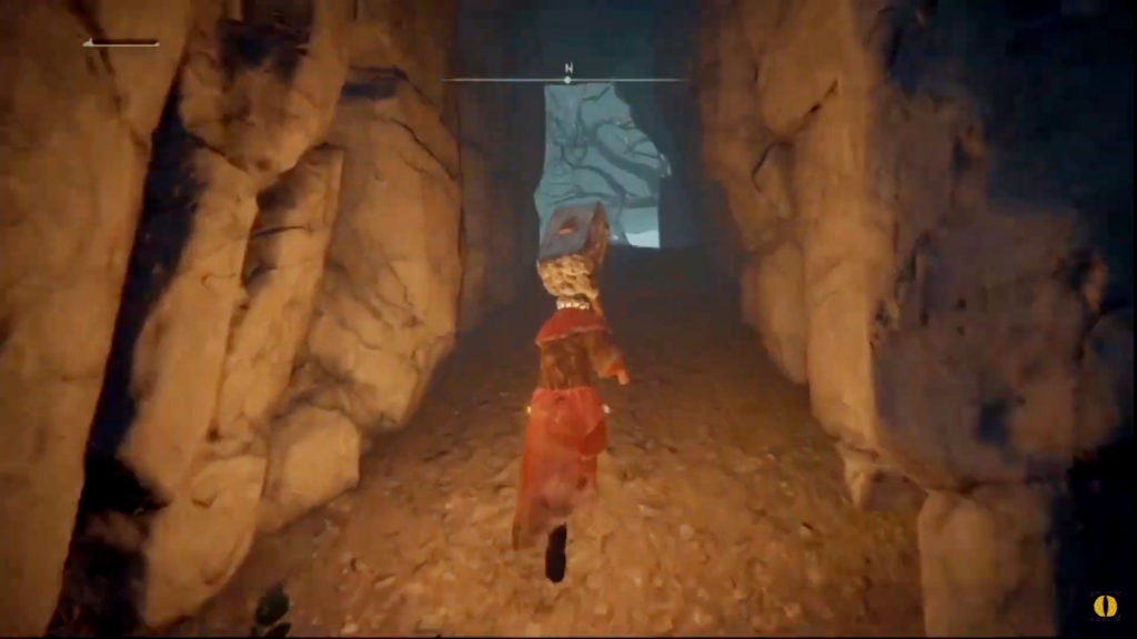 The player walking up a sloped cave.