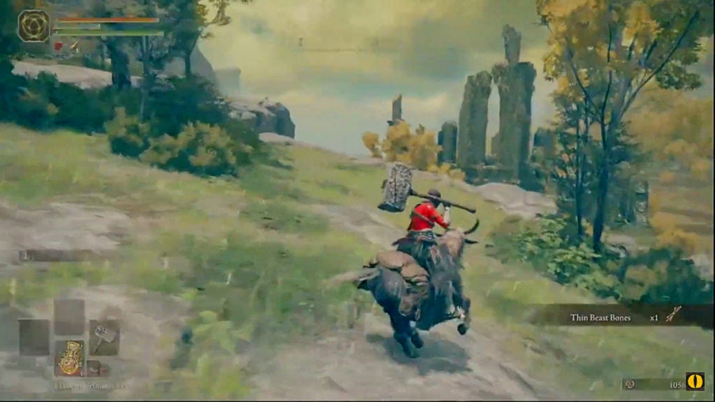 Player with a hammer exploring a hilly part of Limgrave while on horseback.