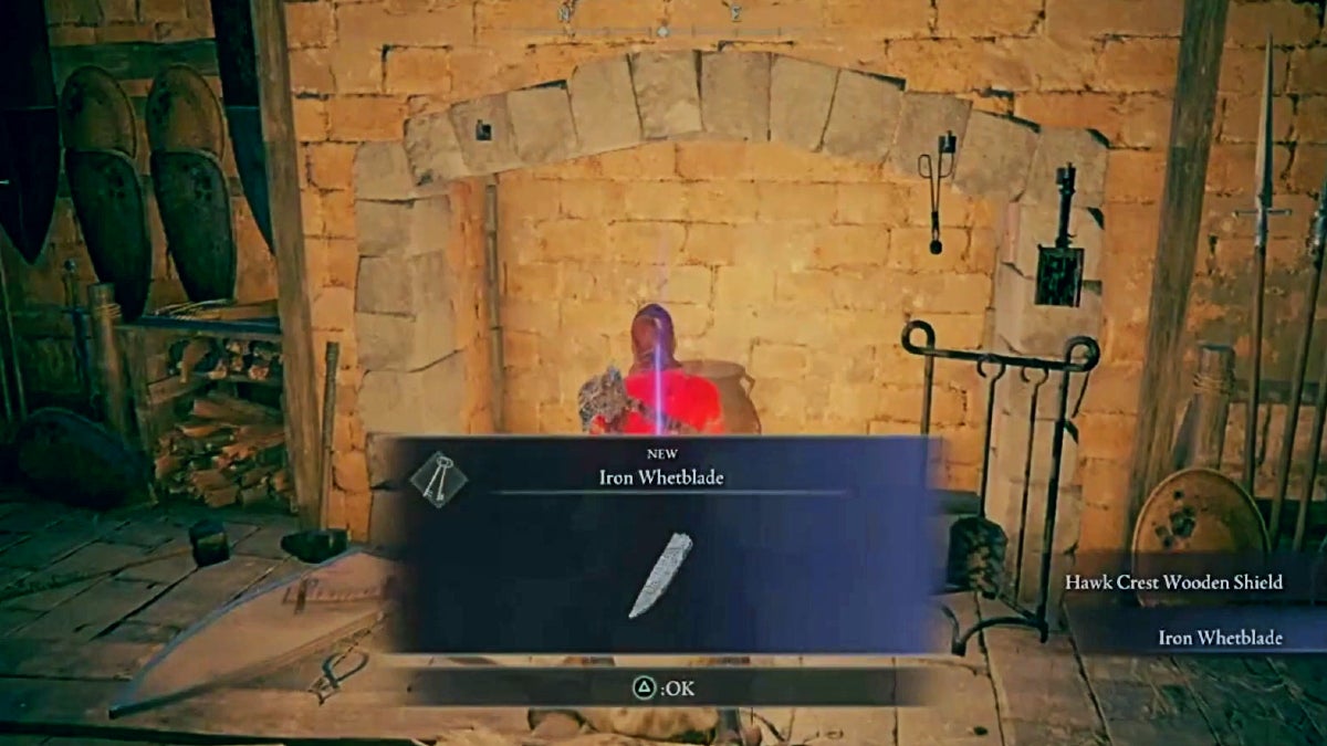 The player picking up the Iron Whetblade, which is a gray knife blade.