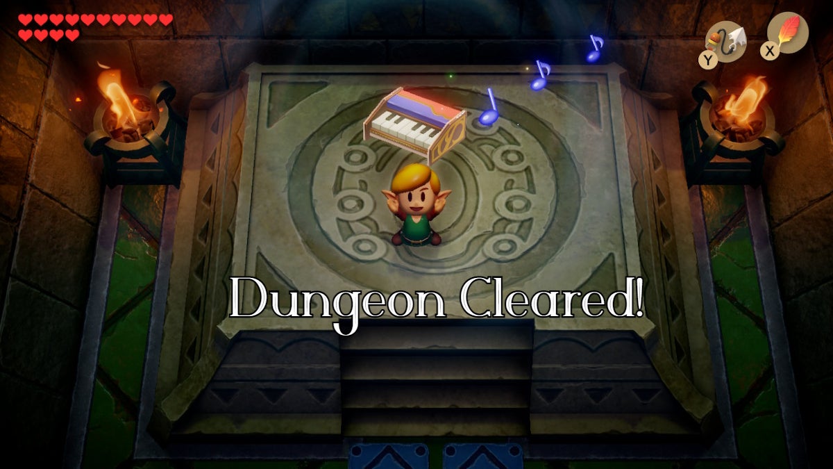 Link holding up the Organ of Evening Calm with the text "dungeon cleared" below him.