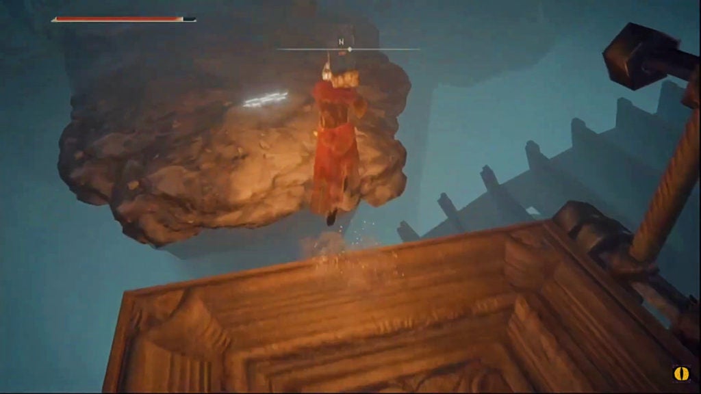 The player jumping onto a ledge jutting out of a cliff from the lift's platform.