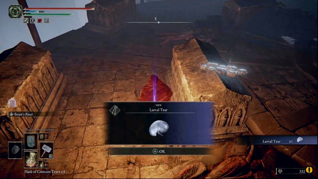 The player picking up a Larval Tear in a dark area. The Larval Tear is a white blob.