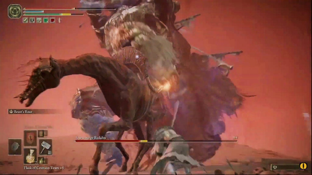 The player attacking Radahn with a hammer.