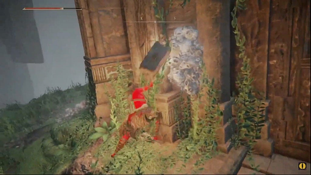 The player attacking some growths that look like white skulls covering the outside of the walking mausoleum.