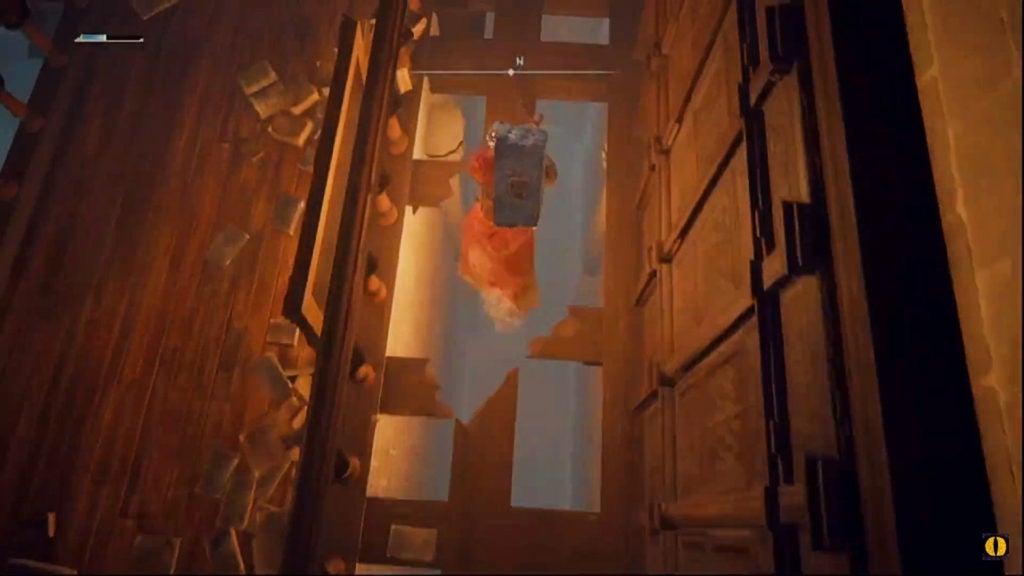 The player dropping down through a gap in some wooden beams of a ceiling.