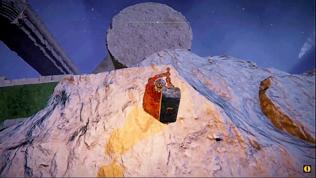 The player on a cliff looking at a broken column.