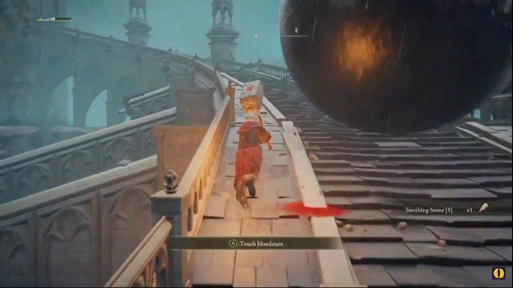 The player avoiding a huge boulder on a ramp by walking to the left of it.