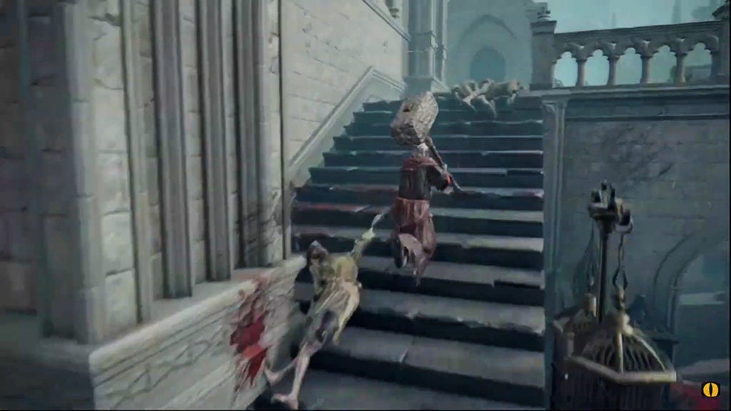 The player running up some stairs to the northwest.