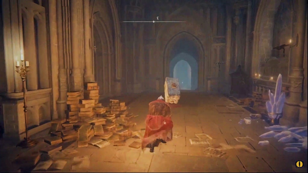 The player sneaking through a hallway full of books.
