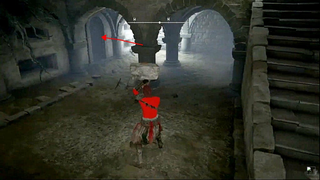 A red arrow pointing towards a tunnel in the room that leads to the left.