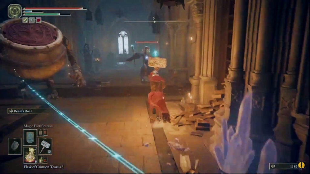 The player charging towards a sorcerer while a living jar stands nearby.