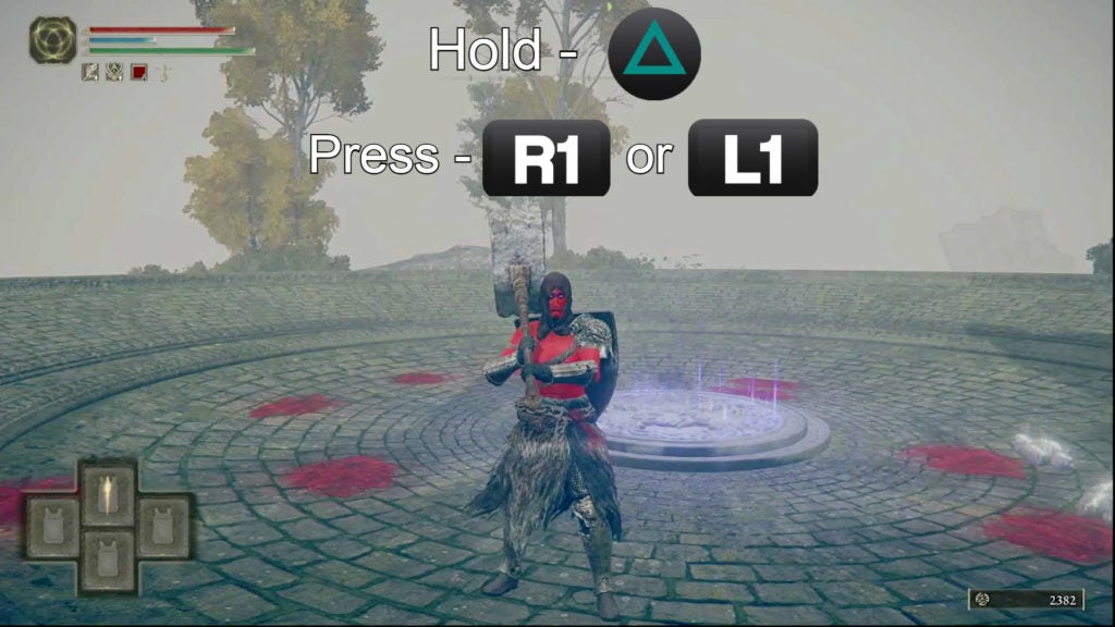 Player holding their hammer with 2 hands. The controls for how to do this are on the image: hold the triangle button and press R1 or L1".
