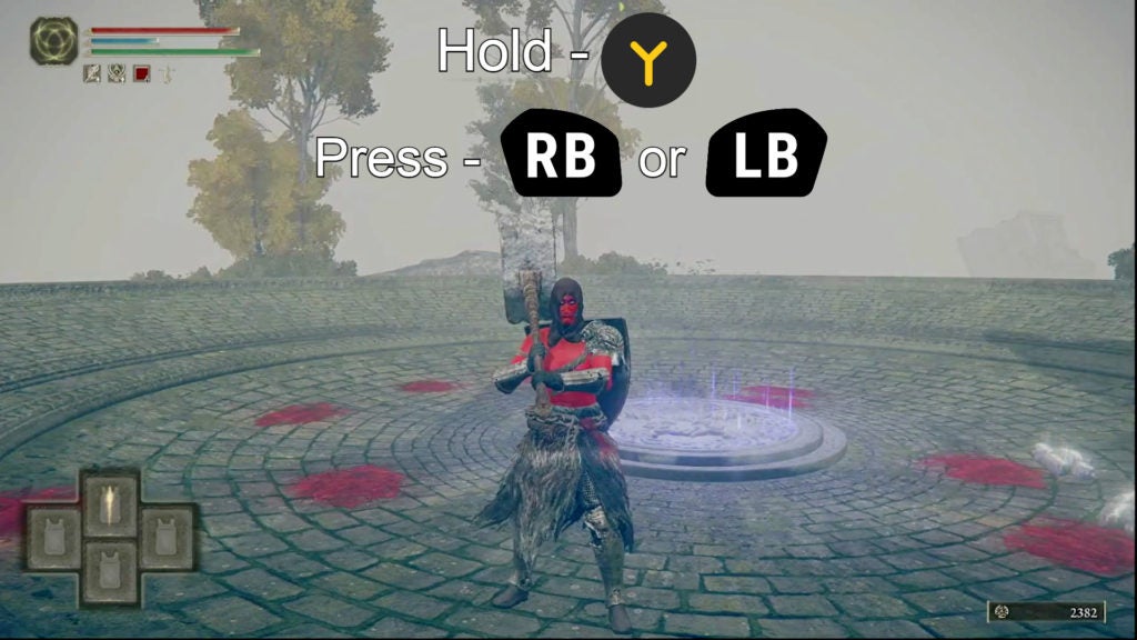 Player holding their hammer with 2 hands. The controls for how to do this are on the image: hold the Y button and press RB or LB".