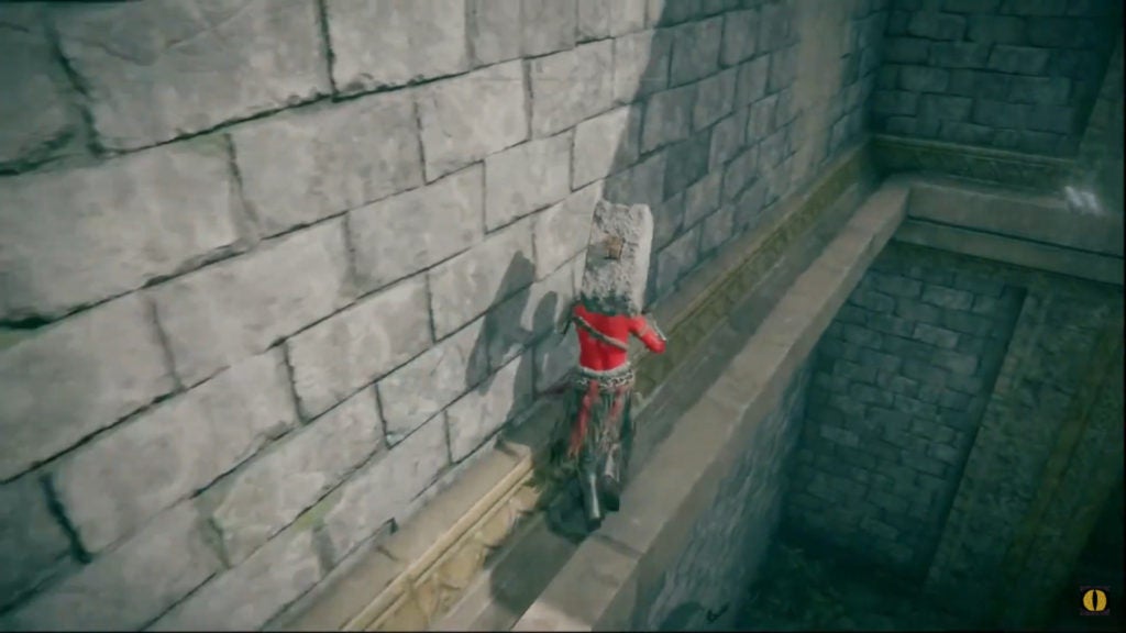 The player walking along a thin ledge on a wall of Stormveil Castle.