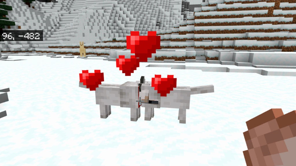 Two wolves nuzzles while red hearts appear above their heads.