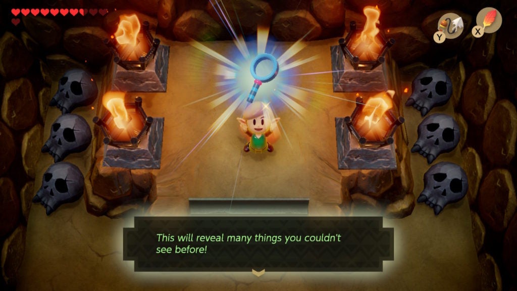 Link holding up the Magnifying Lens with its description on the bottom of the screen. The description says it's used to find invisible things.