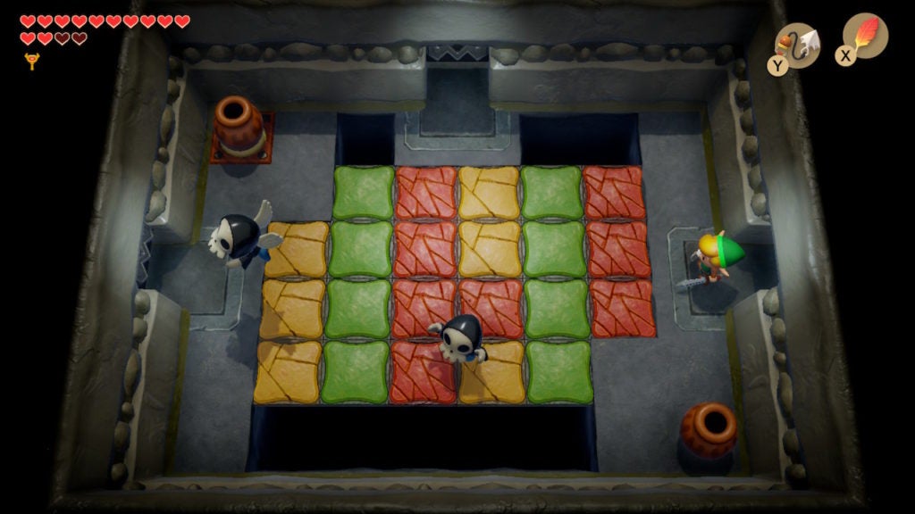 Link in a room with many colorful floor tiles and 2 Bone Putters.