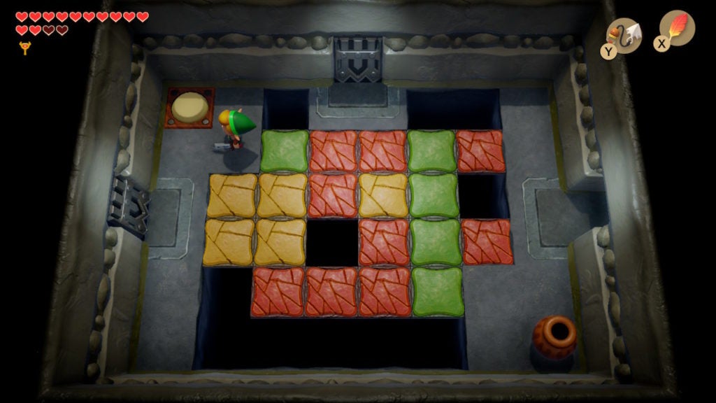 Link finding a floor button in the northwest of the room.