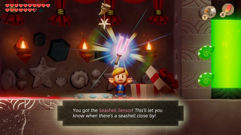 Link holding up the Seashell Sensor, which looks like a pink tuning fork.