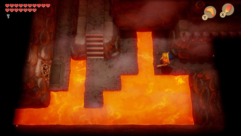Link looking at some stairs across some lava pools.