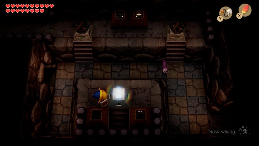 Link opening a locked block in the center of a dark room.