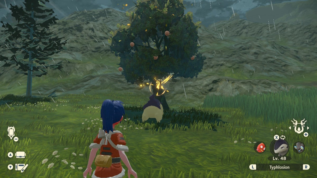 Shaking berries from trees in Pokémon Legends: Arceus.