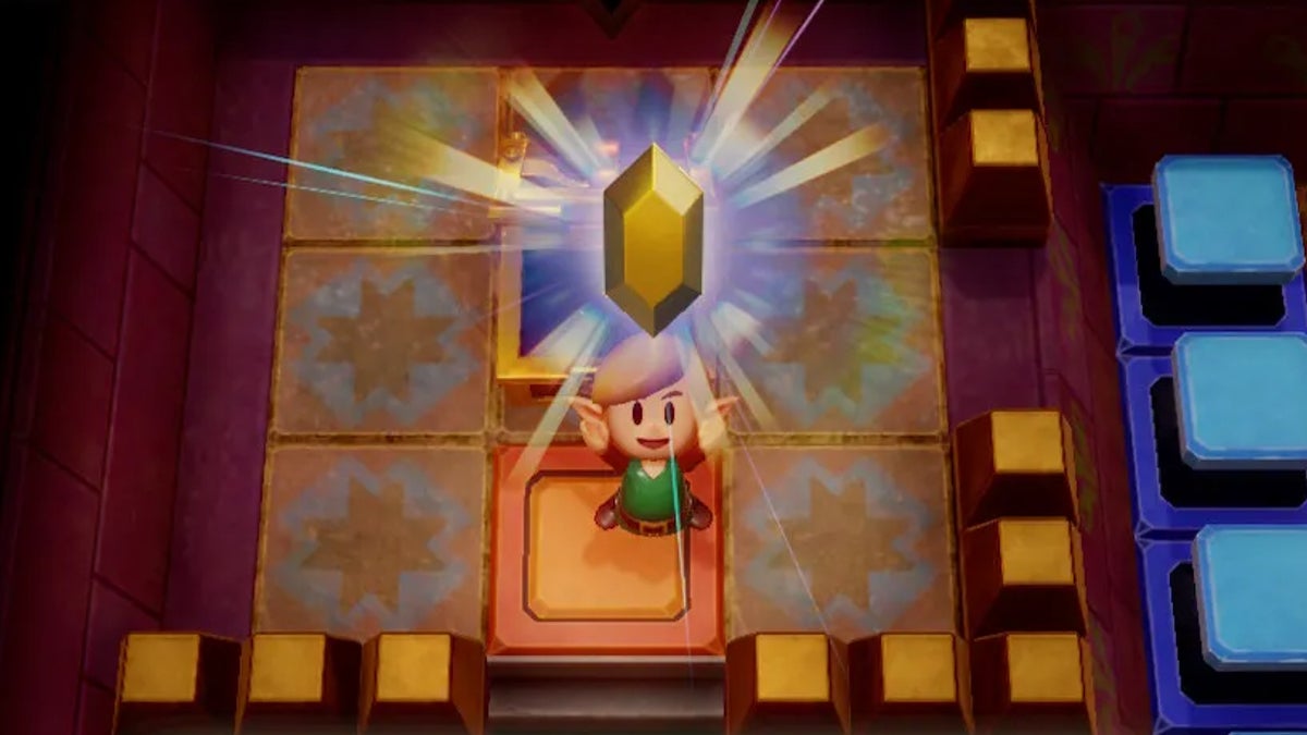 Link holding up a Gold Rupee above their head.