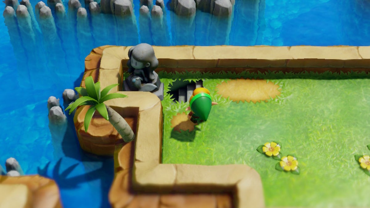 Link finding a hidden staircase next to a mermaid statue.