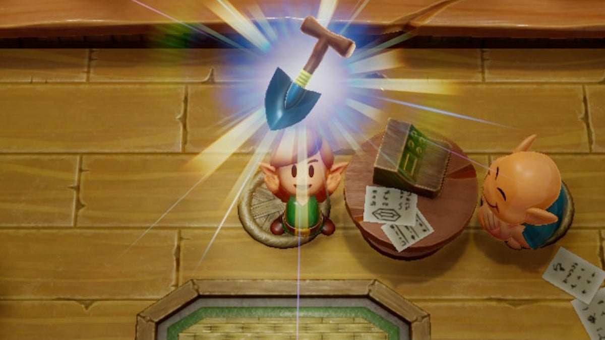 Link holding the Shovel above his head happily.