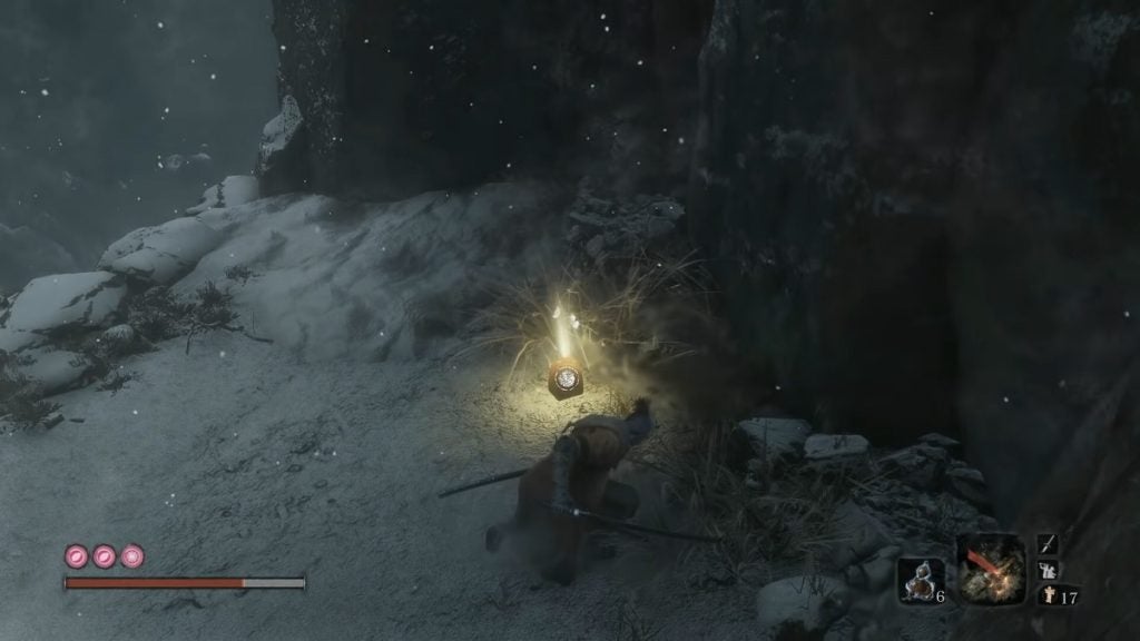 Sekiro crouching before the second Snap Seed pouch in Sunken Valley.
