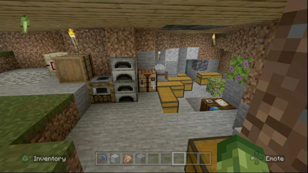 The inside of a house that is underground. There are furnaces, chests, and a crafting table among other blocks.