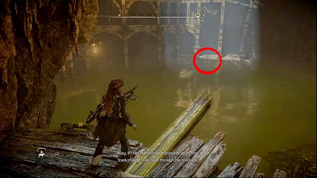 Aloy looking into the main flooded chamber of Crimson Narrows mine. There is a red circle showing the way to progress.