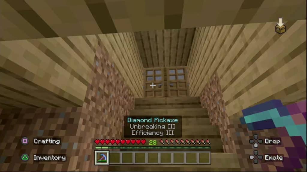 A player seeing the enchantments on their enchanted diamond pickaxe: Unbreaking III and Efficiency III.