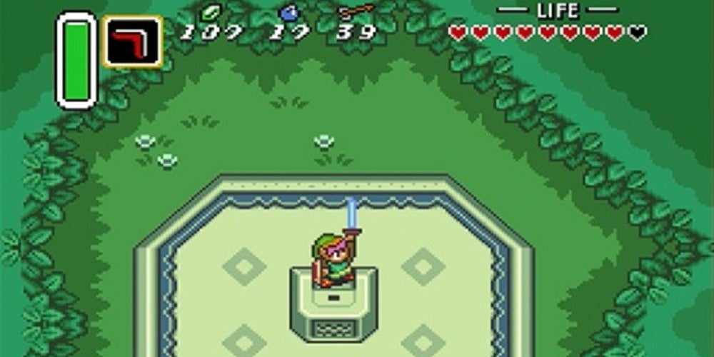 Link holding his sword above his head while standing on a pedestal in the woods.