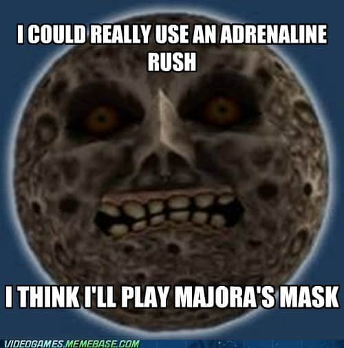 The scary face moon from Majora's Mask with a caption indicating that players play this game for an adrenaline rush.